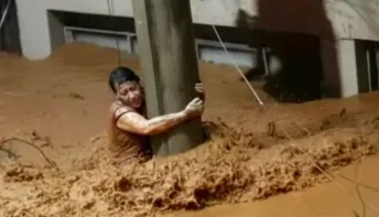 Mulher sobrevive após 3h agarrada a um poste durante enchentes em MG